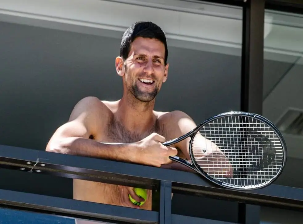 Novak Djokovic holding his HEAD Tennis Racquet
